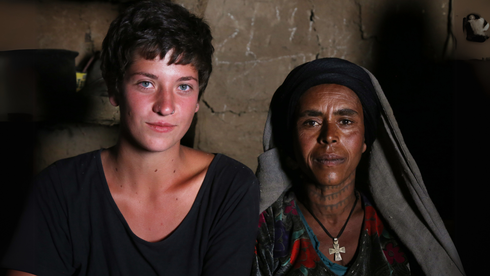 YWAMer sitting next to an Ethiopian woman