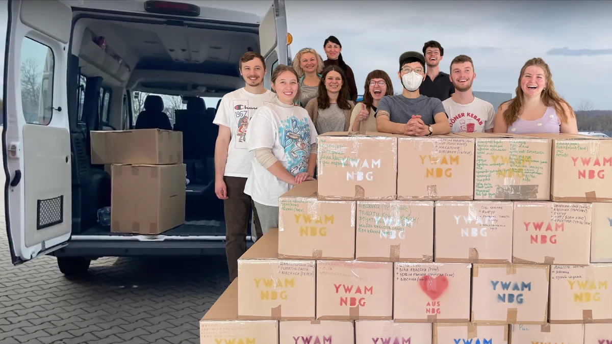 YWAMers and Ukrainians packing boxes of food aid to send to Ukraine