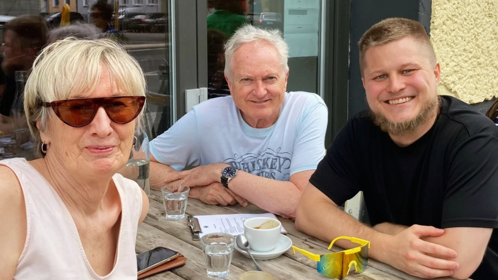 Jim and Judy Orred sitting at a table with another YWAMer