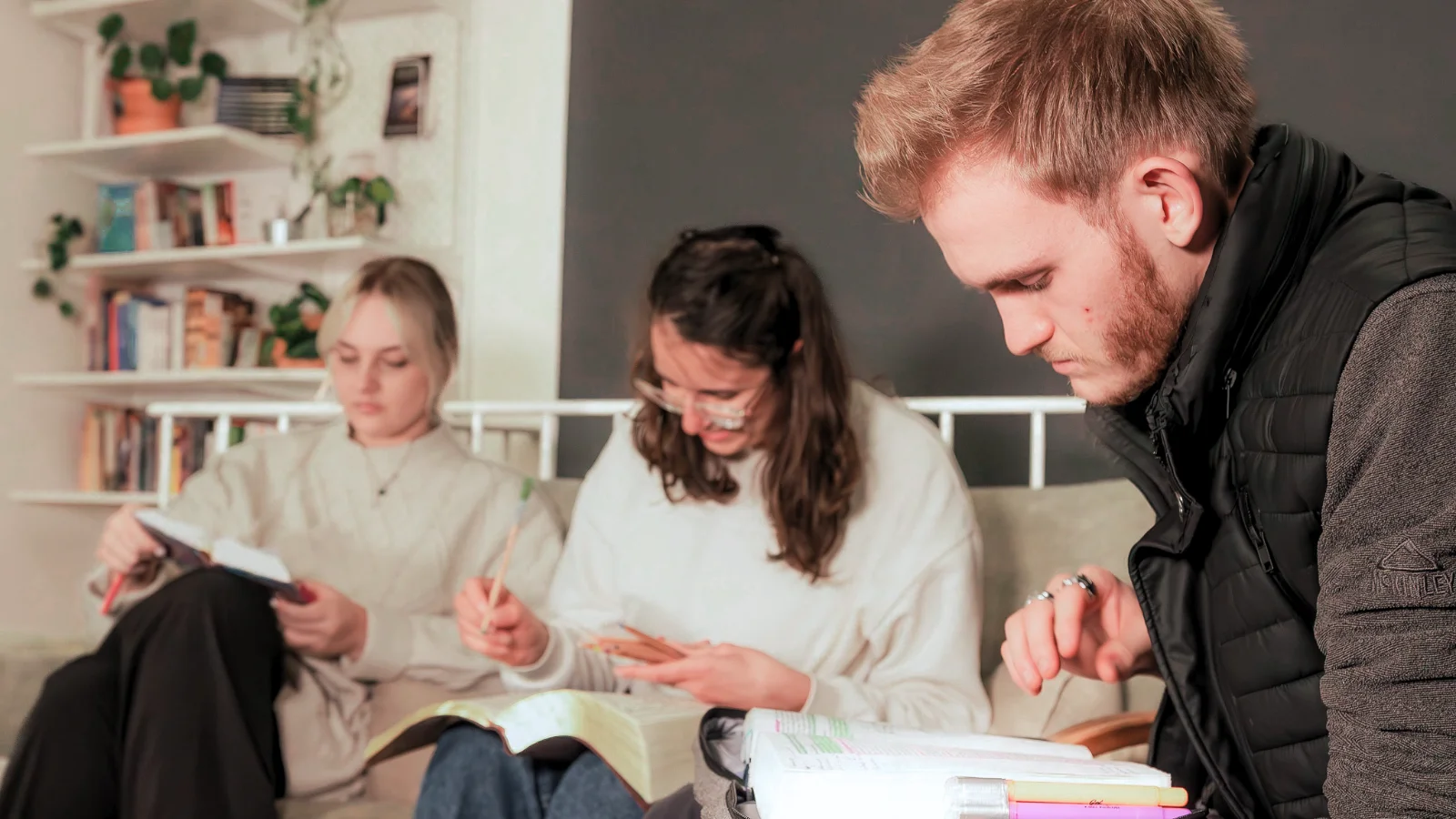 Students studying the Bible together