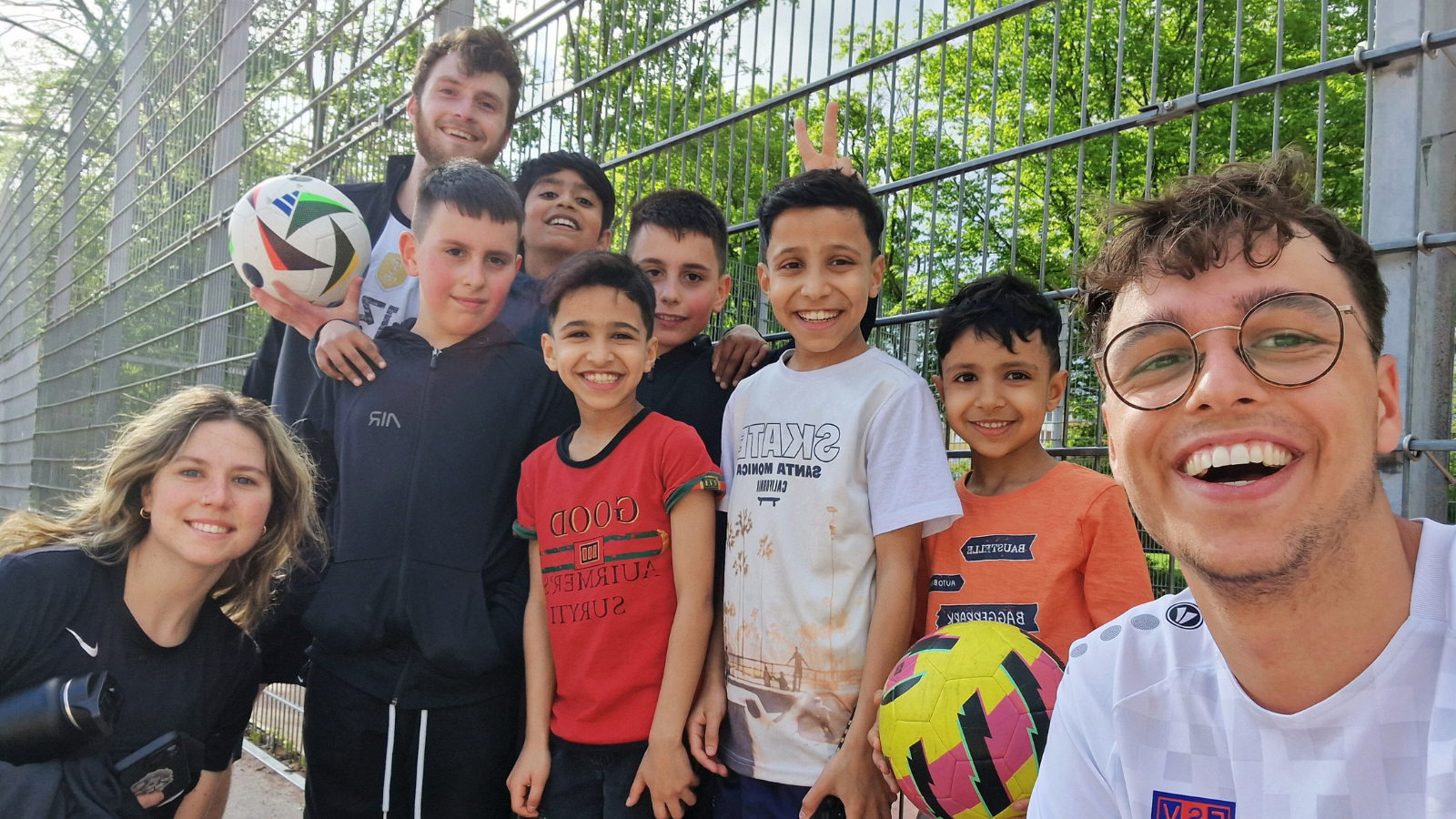 YWAMers playing soccer with kids