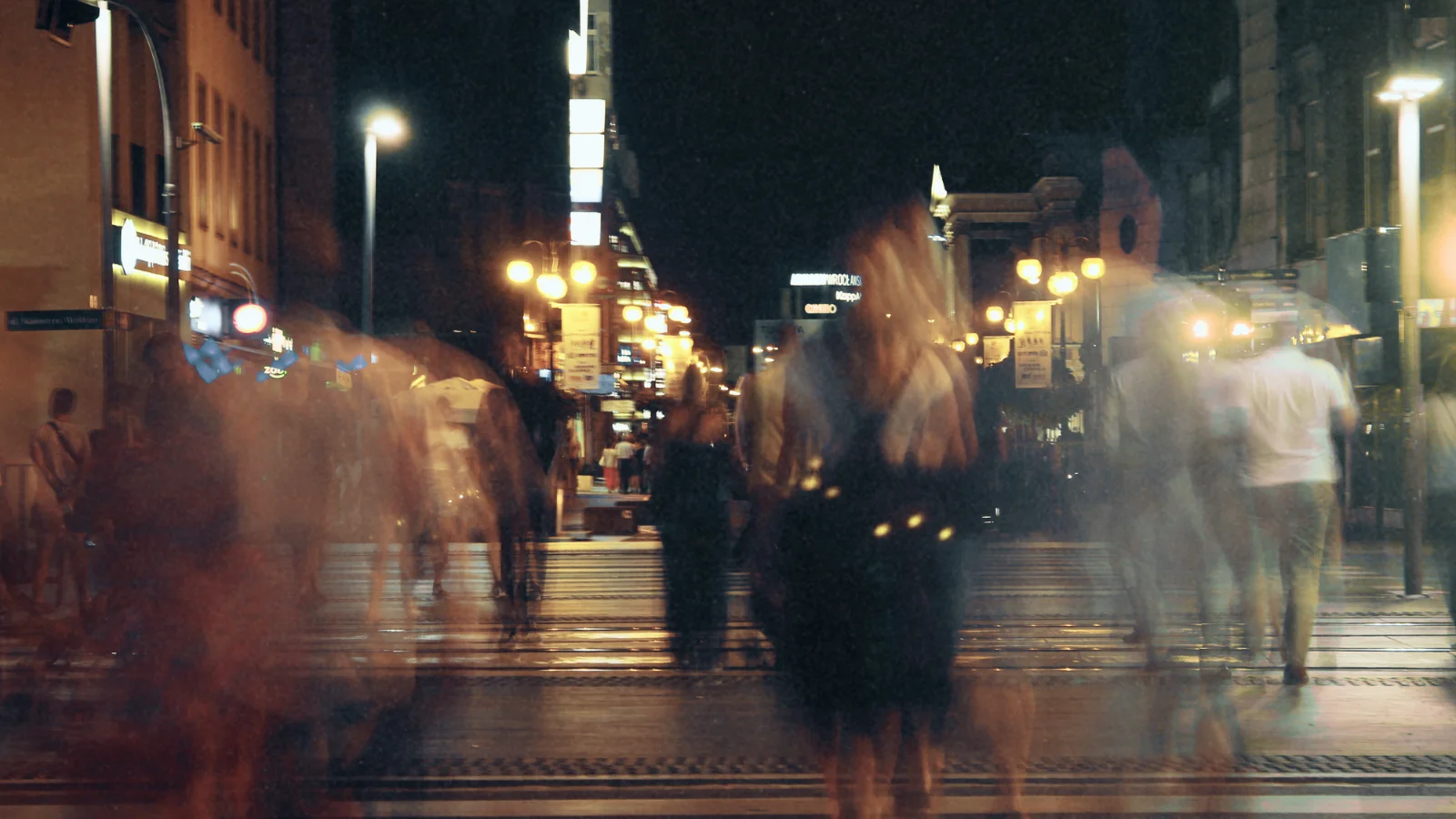 people walking on a city street